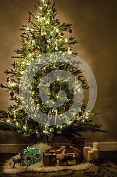 Christmas tree with beautiful lights, decoration, toys and gifts