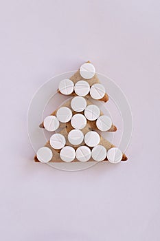 Christmas tree biscuits. White tablets. Light background