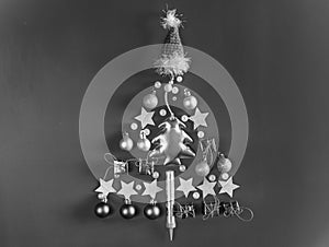 Christmas tree black and white silhouette of gift boxes, new year balls, stars, beads and Santa Claus hat festive