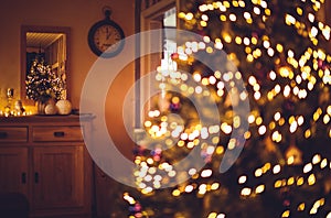 Christmas tree with bokeh lights and ornament against