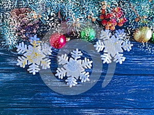 Christmas tree branch, ball on decorative wooden background
