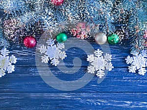 Christmas tree branch, ball on wooden background