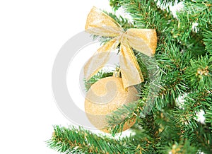 Christmas tree branch with golden decorations beckground