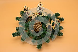 Christmas tree branch with pine cone and decorations