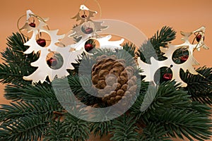 Christmas tree branch with pine cone and decorations