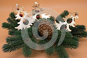Christmas tree branch with pine cone and decorations