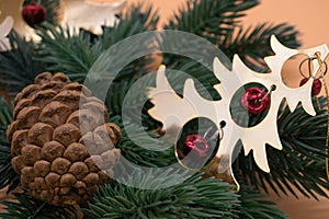 Christmas tree branch with pine cone and decorations