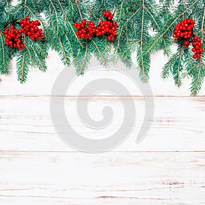 Christmas tree branch with red berries. Holidays decoration retr