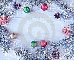 Christmas tree branch, snow celebration seasonal on a white wooden background frame