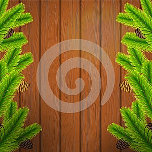 Christmas tree branch on wood