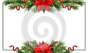 Christmas tree branches, bells and red poinsettia flower in a holiday frame isolated on white