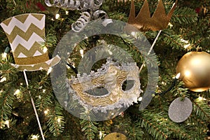 Christmas tree with branches covered in Mardi Gras theme