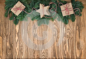 Christmas tree branches gift boxes wooden background vintage
