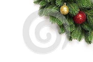 Christmas tree branches isolated on white background with copy space for text. Fir with Christmas toy balls and fir cones.