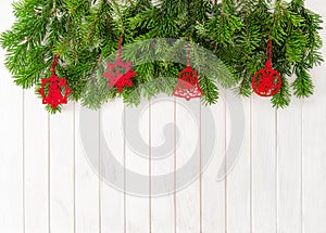 Christmas tree branches red decoration wooden background