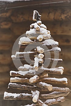 Christmas tree of branches and snow as background