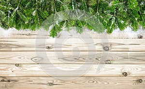 Christmas tree branches snow decoration wooden background
