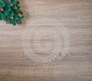 Christmas tree on brown wooden texture background.