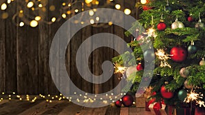 Christmas tree with burning sparklers and wood background