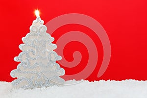 Christmas tree candle red background