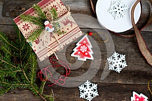 Christmas tree, Christmas gift and Christmas decorations on a wooden background