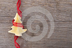 Christmas tree cookie with red ribbon