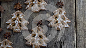 Christmas tree cookies on wooden background. New Year's food. Anise star. Festive baked goods. Gingerbread on the table