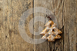 Christmas tree cookies on wooden background. New Year's food. Anise star. Festive baked goods. Gingerbread on the table