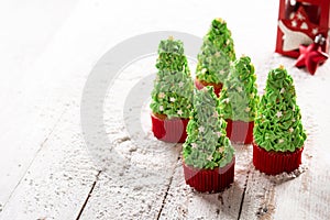 Christmas tree cupcakes on snow
