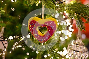 Christmas tree decorated is festivily decorated with vintage colorful balls, garlands and toys