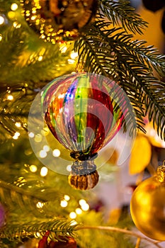 Christmas tree decorated is festivily decorated with vintage colorful balls, garlands and toys close up, Christmas background