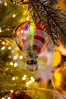 Christmas tree decorated is festivily decorated with vintage colorful balls, garlands and toys close up, Christmas background