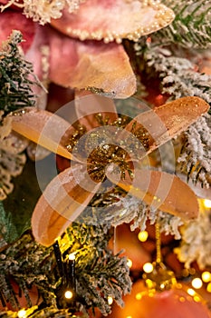 Christmas tree decorated is festivily decorated with vintage colorful balls, garlands and toys close up, Christmas background