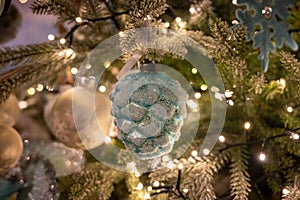 Christmas tree decorated is festivily decorated with vintage colorful balls, garlands and toys close up, Christmas background