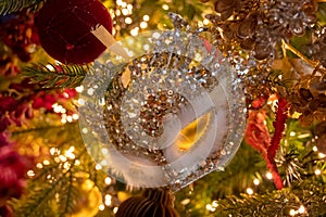 Christmas tree decorated is festivily decorated with vintage colorful balls, garlands and toys close up, Christmas background