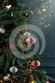 Christmas tree decorated with handmade eco paper ball, closeup view