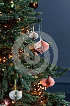 Christmas tree decorated with handmade eco paper ball, closeup view