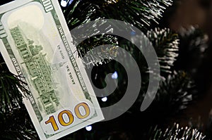 Christmas tree decorated with money. Dollar banknote as Christmas tree toy. Rich year concept. Best gift for Christmas. Happy new