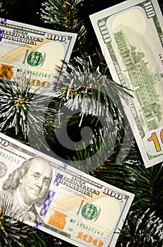 Christmas tree decorated with money. Dollar banknotes as Christmas tree toy. Rich year concept. Best gift for Christmas. Happy new