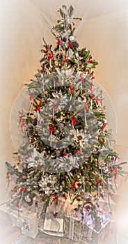 Christmas tree decorated with natural ornaments made of pine cones and palm leaves