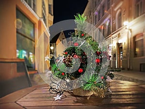 Christmas tree  decorated on  wooden  table top at street in old town of Tallinn holiday in Estonia