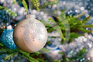 Christmas-tree decoration bauble on decorated Christmas tree bac photo