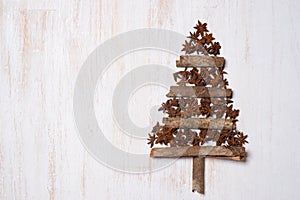 Christmas tree decoration with copy space on white wooden background