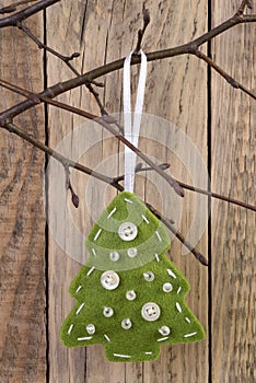 Christmas tree decoration hanging on a twig