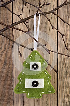 Christmas tree decoration hanging on a twig