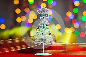 Christmas tree decoration ornament isolated on blurred background of  lights