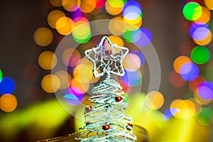 Christmas tree decoration ornament isolated on blurred background of  lights