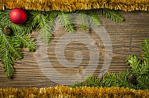 Christmas tree with decoration over old wooden background
