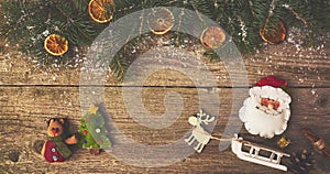 Christmas tree with decoration over wood table. Space for text