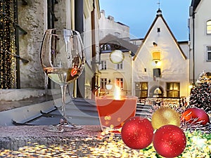 Christmas tree  decoration red gold ball  ,Tallinn old town red candle glass of  champagne night  city blurred light  on medieval